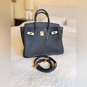 Black Leather Handbag with Gold Accents
